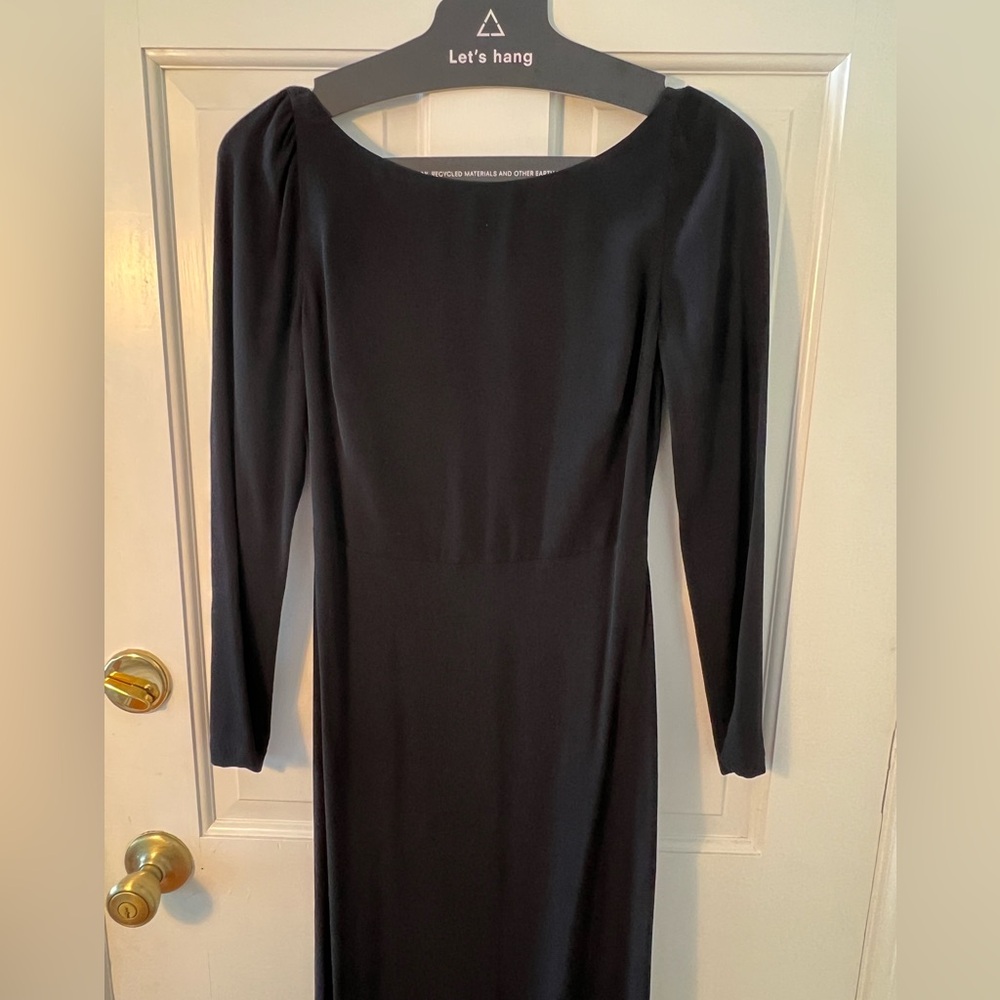 The Reformation black maxi long sleeve backless dress with a slight long tail